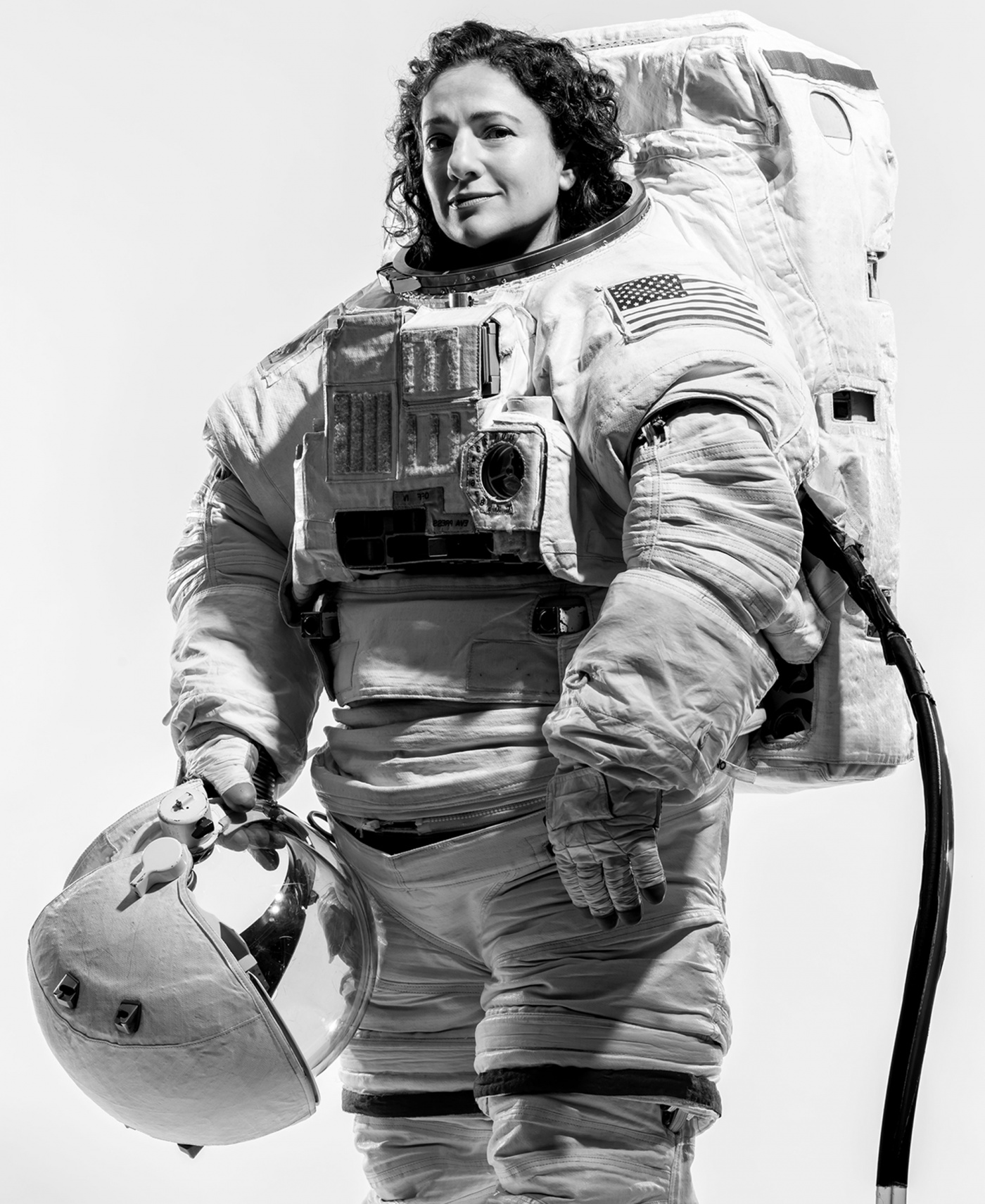 Jessica Meir &rsquo;99 poses in her spacesuit
